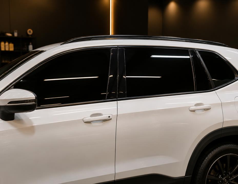 White SUV with freshly installed dark window tint